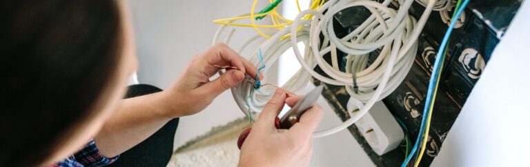 Unrecognizable female technician installing lan network